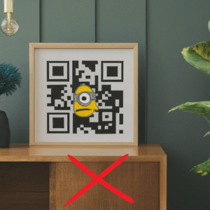 a QR code having a minion's image at its center, which is a bad practice as QR codes should not contain any graphics inside them for better scannability